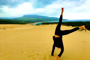 Handstand Yoga on the beach in bolonia Spain Adho Mukah Svasana España Retiro Retreat